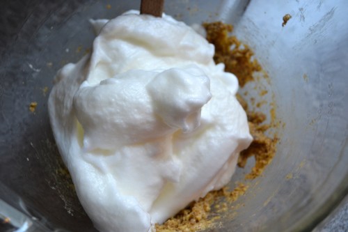 folding egg whites into the almond batter