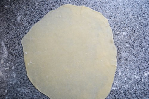 rolling out tortillas