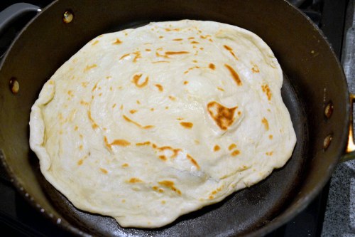 roti in frying pan